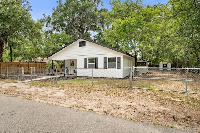 4120 NW 10th St, Gainesville, FL 32609 - view of front of house with a shed and a gate