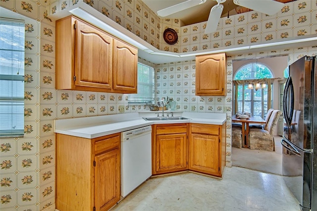 12332 NW 7th Ln, Newberry, FL 32669 - kitchen with light countertops, dishwasher, freestanding refrigerator, and ceiling fan