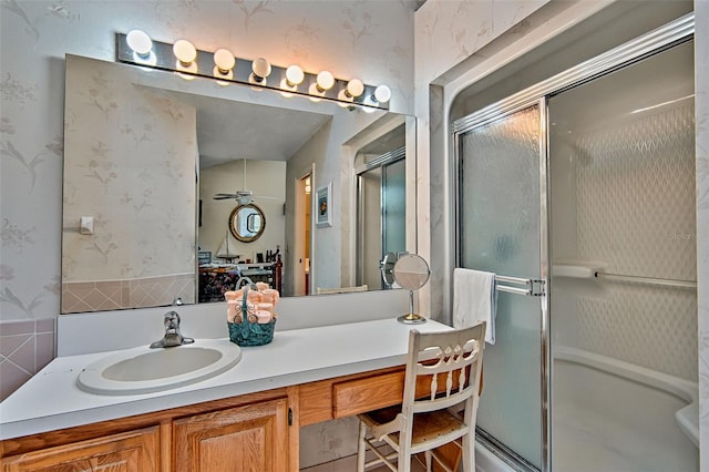 12332 NW 7th Ln, Newberry, FL 32669 - full bathroom with a shower stall, vanity, wallpapered walls, and wainscoting