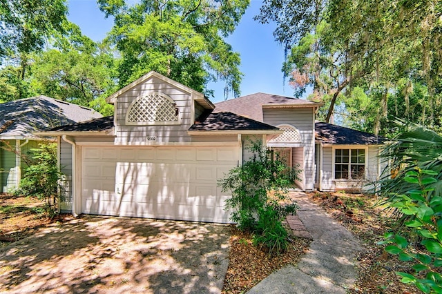 12332 NW 7th Ln, Newberry, FL 32669 - view of front of home with a garage and aphalt driveway
