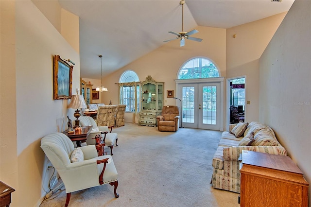 12332 NW 7th Ln, Newberry, FL 32669 - living area with ceiling fan with notable chandelier, french doors, carpet flooring, and high vaulted ceiling