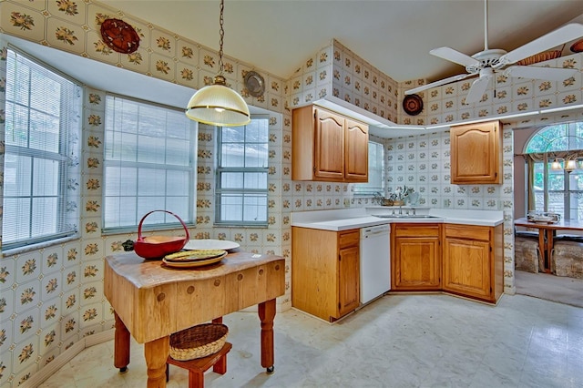 12332 NW 7th Ln, Newberry, FL 32669 - kitchen featuring light countertops, wallpapered walls, dishwasher, and a sink