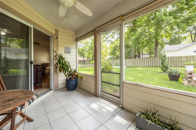 sunroom with a ceiling fan