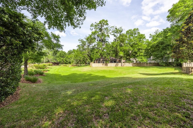 view of yard with fence