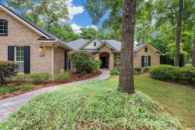 4535 SW 105th Dr, Gainesville, FL 32608 - view of front of house with brick siding and a front yard