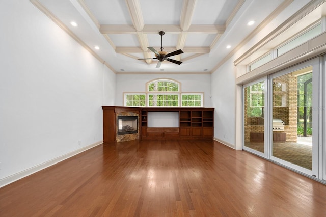 4535 SW 105th Dr, Gainesville, FL 32608 - unfurnished living room with coffered ceiling, hardwood / wood-style floors, beamed ceiling, a ceiling fan, and baseboards