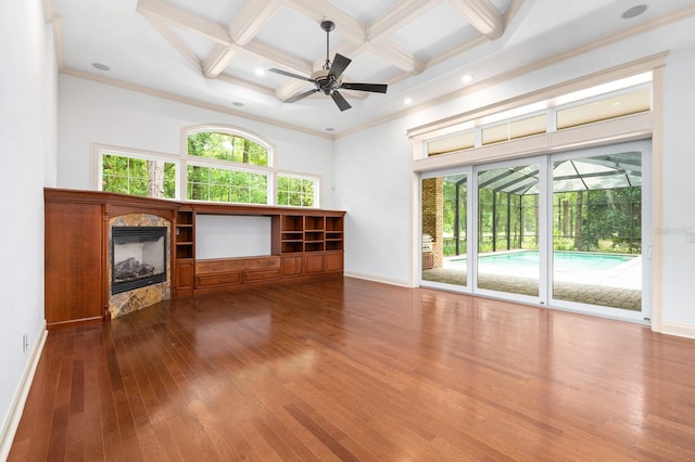 4535 SW 105th Dr, Gainesville, FL 32608 - unfurnished living room with coffered ceiling, dark wood finished floors, baseboards, beamed ceiling, and a towering ceiling