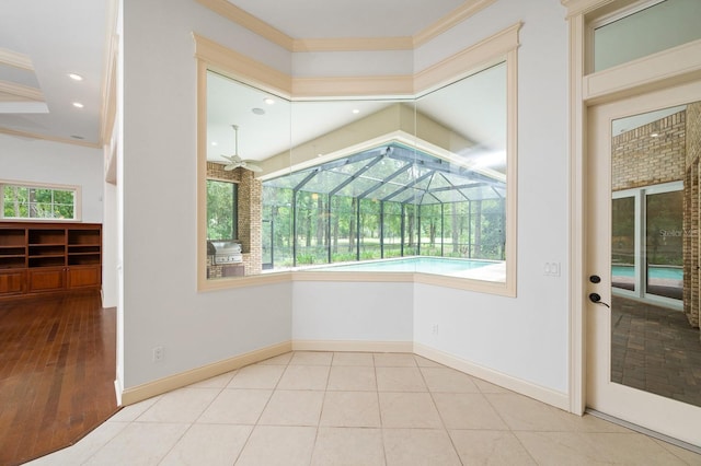 4535 SW 105th Dr, Gainesville, FL 32608 - unfurnished dining area with ornamental molding, a sunroom, recessed lighting, and baseboards