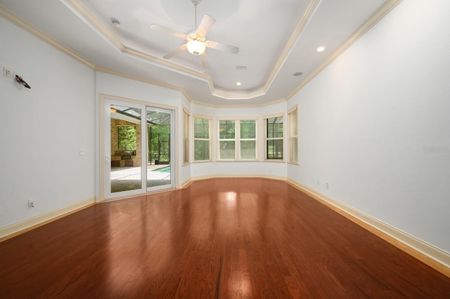 4535 SW 105th Dr, Gainesville, FL 32608 - unfurnished room with a tray ceiling, wood finished floors, crown molding, a ceiling fan, and baseboards