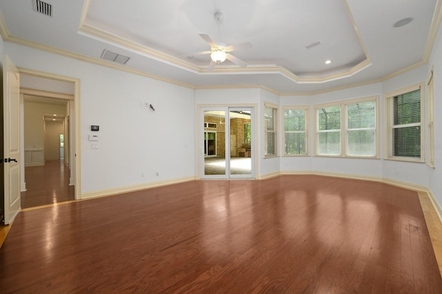 4535 SW 105th Dr, Gainesville, FL 32608 - unfurnished living room featuring a raised ceiling, ceiling fan, wood finished floors, crown molding, and baseboards