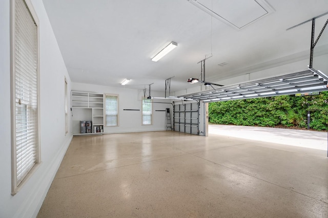 4535 SW 105th Dr, Gainesville, FL 32608 - garage with baseboards and a garage door opener