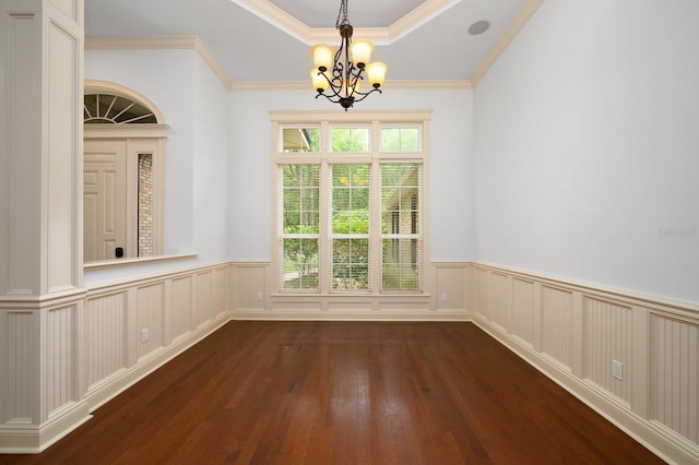 4535 SW 105th Dr, Gainesville, FL 32608 - unfurnished dining area with a chandelier, a wainscoted wall, dark wood finished floors, crown molding, and a decorative wall