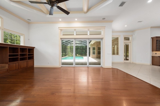 4535 SW 105th Dr, Gainesville, FL 32608 - unfurnished living room with ceiling fan, crown molding, wood finished floors, recessed lighting, and baseboards