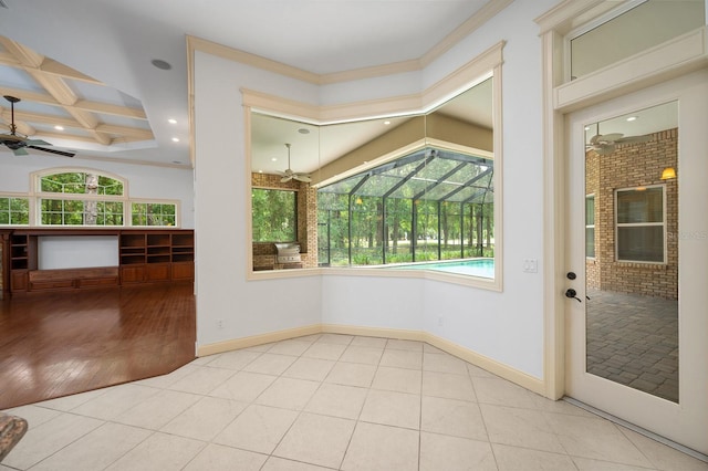 4535 SW 105th Dr, Gainesville, FL 32608 - empty room with ceiling fan, coffered ceiling, tile patterned flooring, baseboards, and crown molding