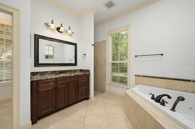 4535 SW 105th Dr, Gainesville, FL 32608 - bathroom featuring ornamental molding, a garden tub, tile patterned floors, vanity, and baseboards