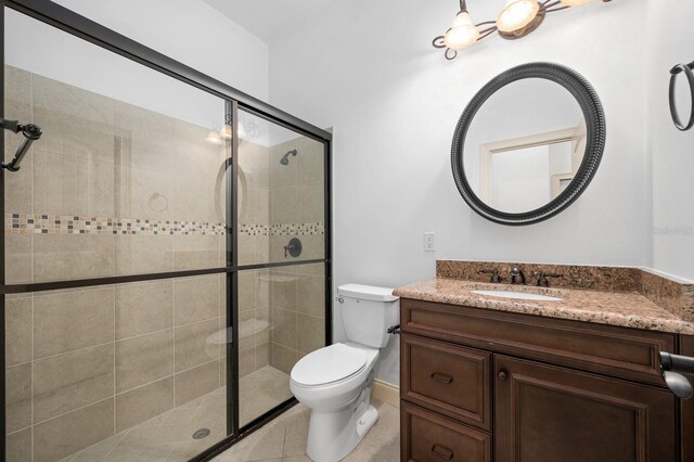 4535 SW 105th Dr, Gainesville, FL 32608 - bathroom with a stall shower, toilet, vanity, and tile patterned floors