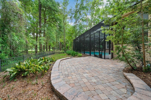 4535 SW 105th Dr, Gainesville, FL 32608 - view of patio featuring fence and glass enclosure