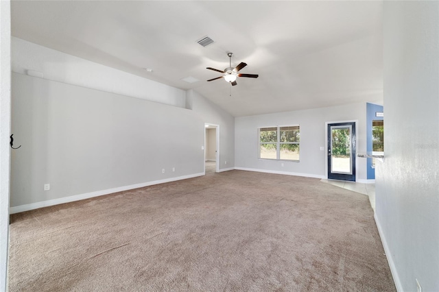 carpeted spare room featuring a ceiling fan, baseboards, lofted ceiling, and visible vents