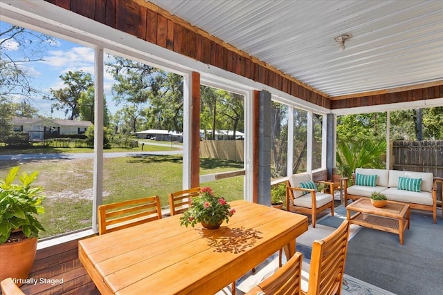 sunroom / solarium with an outdoor living space