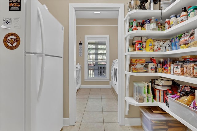 pantry featuring washer and dryer