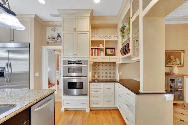 kitchen featuring light stone counters, wine cooler, open shelves, light wood-type flooring, and stainless steel appliances