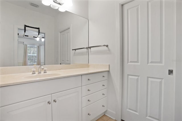 bathroom featuring vanity and visible vents