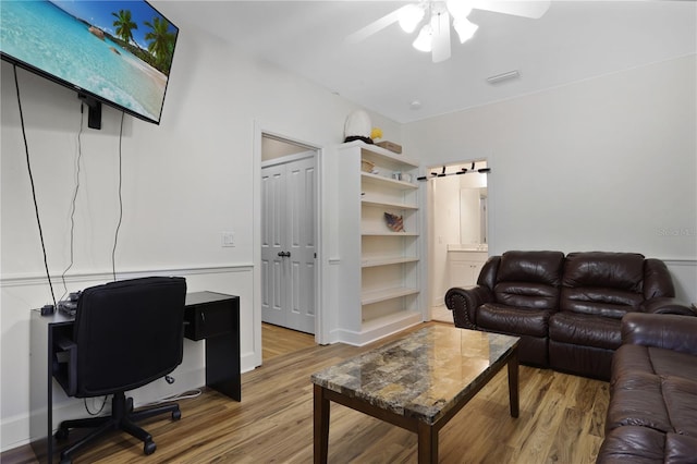 office with visible vents, wood finished floors, and a ceiling fan