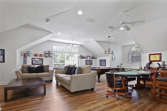 living room featuring visible vents, a ceiling fan, and wood finished floors