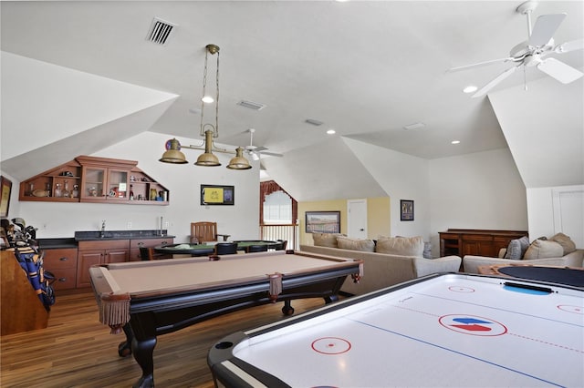 rec room with wood finished floors, visible vents, and ceiling fan