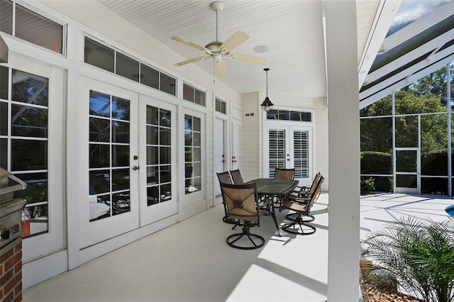 view of patio with french doors, outdoor dining space, and ceiling fan