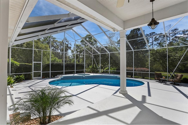 pool featuring an in ground hot tub, a lanai, ceiling fan, and a patio area