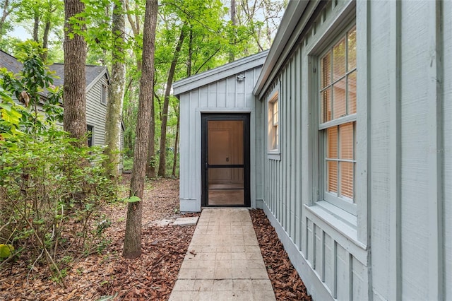 entrance to property featuring board and batten siding