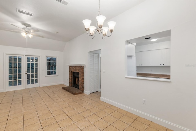 unfurnished living room with vaulted ceiling, a chandelier, baseboards, ceiling fan, and a fireplace