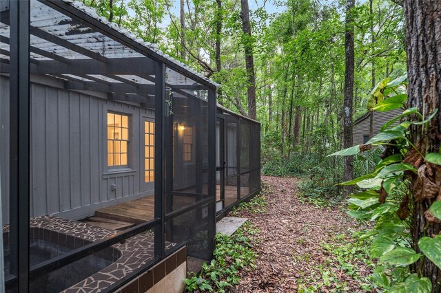 view of side of property with a sunroom