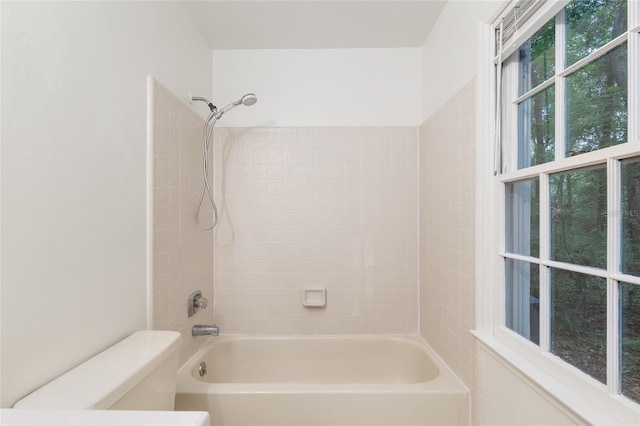 bathroom with toilet and shower / bath combination