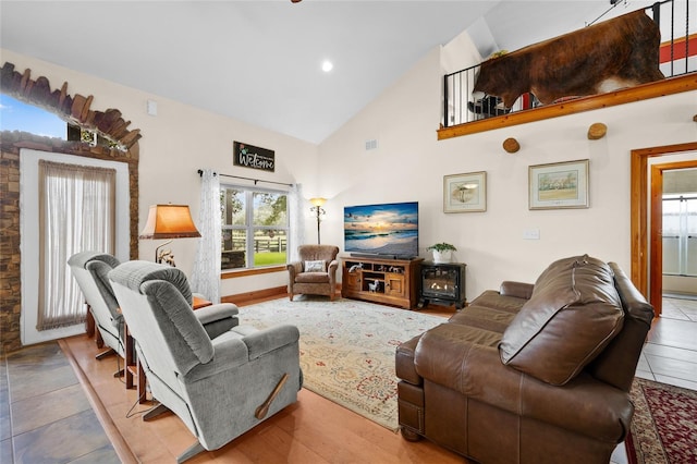 living room featuring visible vents, high vaulted ceiling, and recessed lighting