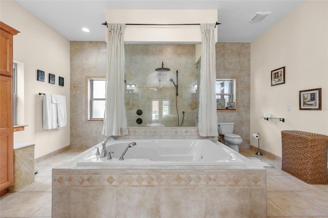full bathroom featuring toilet, a tile shower, tile patterned flooring, and a garden tub