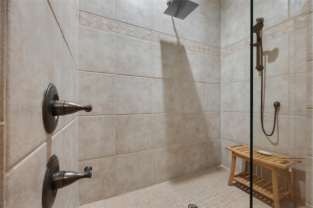 bathroom with tiled shower