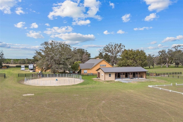 view of yard featuring an enclosed area, fence, and a patio area