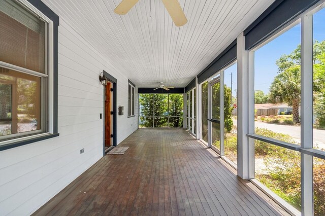 620 NE 6th Ave, Gainesville, FL 32601 - unfurnished sunroom featuring a ceiling fan
