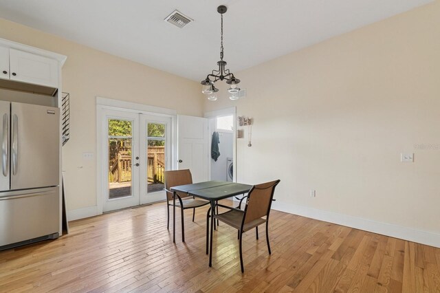620 NE 6th Ave, Gainesville, FL 32601 - dining space with baseboards, visible vents, french doors, and light wood finished floors