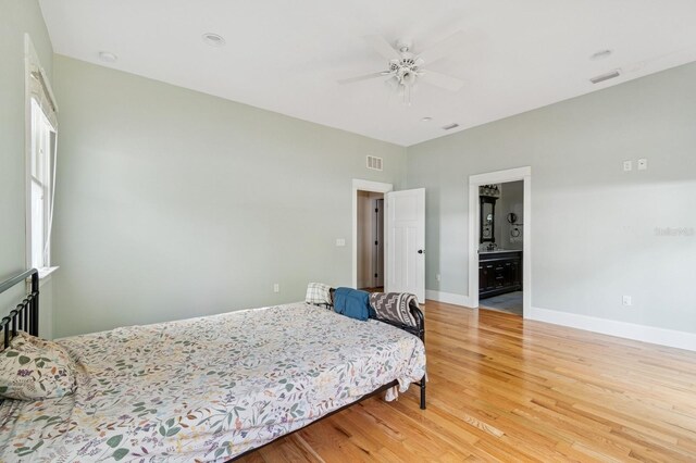 620 NE 6th Ave, Gainesville, FL 32601 - bedroom with visible vents, baseboards, ceiling fan, and light wood-type flooring