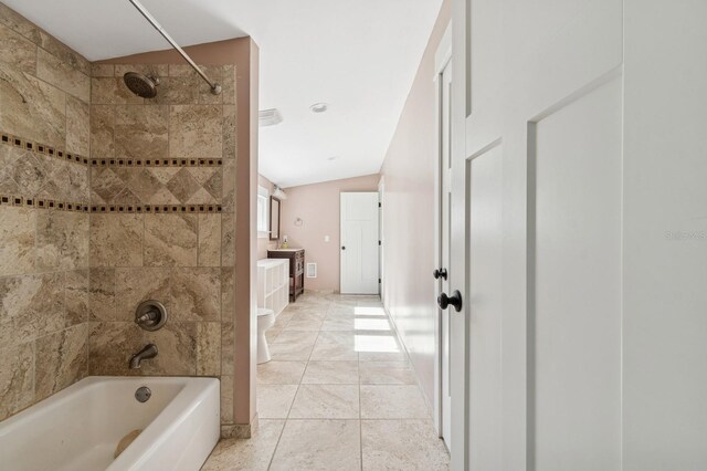 620 NE 6th Ave, Gainesville, FL 32601 - full bath with vanity, lofted ceiling, and shower / washtub combination