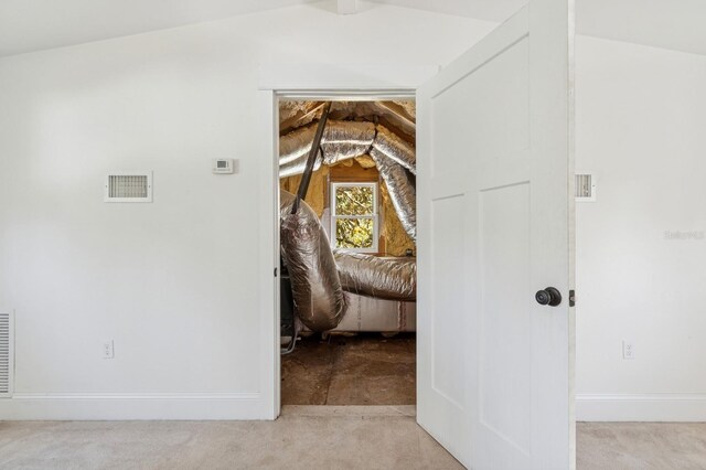 620 NE 6th Ave, Gainesville, FL 32601 - hallway featuring visible vents, carpet flooring, baseboards, and vaulted ceiling