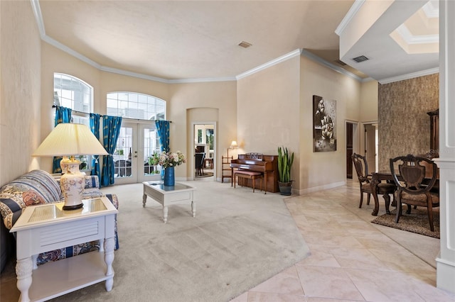 living area featuring tile patterned floors, ornamental molding, french doors, and visible vents