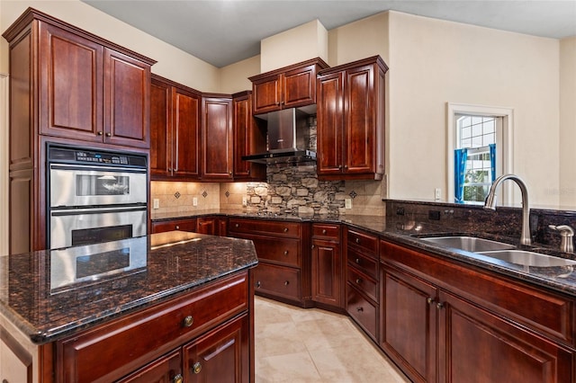 kitchen featuring a sink, exhaust hood, stainless steel double oven, and dark brown cabinets