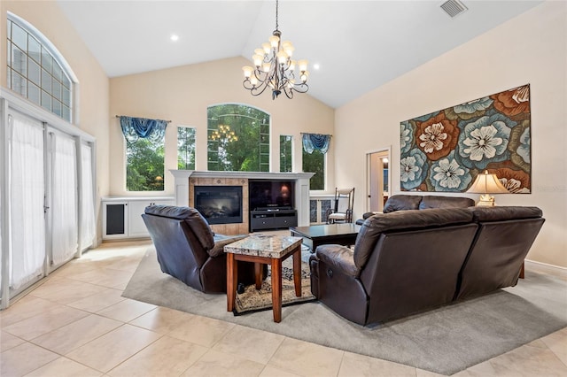 living area with visible vents, light tile patterned flooring, a notable chandelier, and high vaulted ceiling