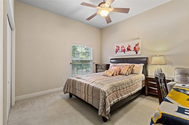 bedroom featuring baseboards, ceiling fan, and carpet floors