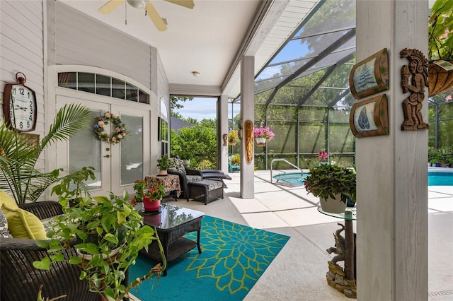 sunroom / solarium with an outdoor hangout area, ceiling fan, and french doors