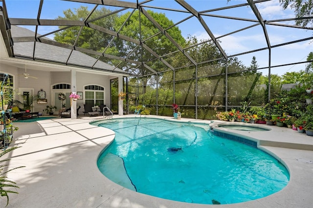 view of pool featuring a lanai, a patio, and a pool with connected hot tub